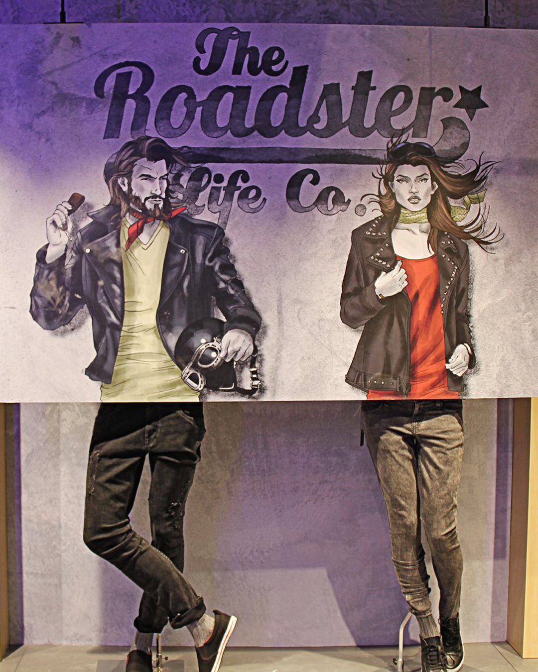 JUMPINGGOOSE-designed Roadster window highlighting how a visual merchandiser blends art and apparel for strong visual merchandising.