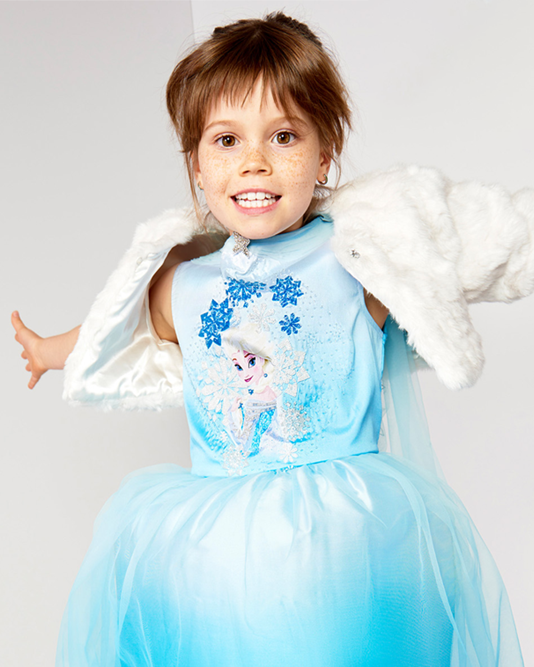 Child modelling a blue princess gown with a short jacket; Disney & Me trend-based collection design by JUMPINGGOOSE.