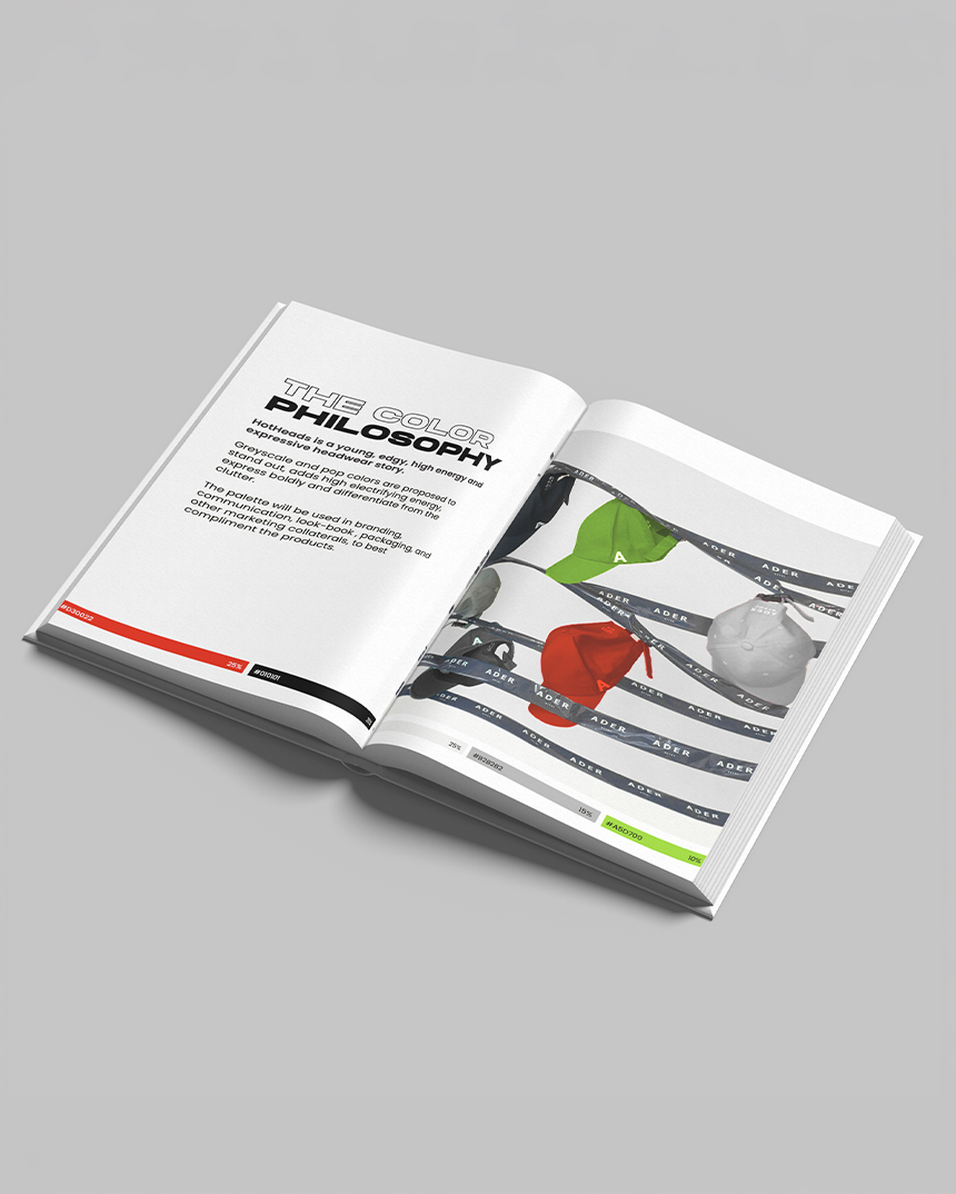Open HotHeads brand guideline book showing colour philosophy and cap design system
