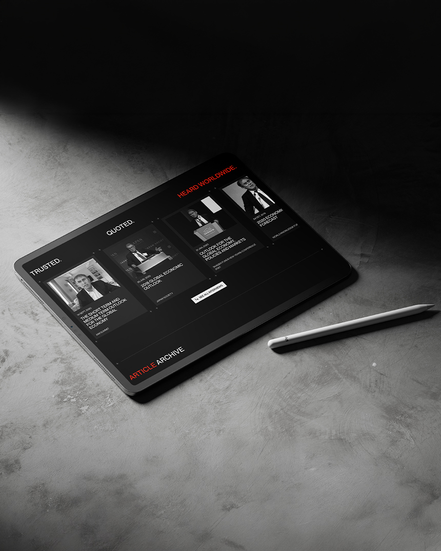 Nouriel Roubini thought leadership website shown on tablet with article archive and media content cards