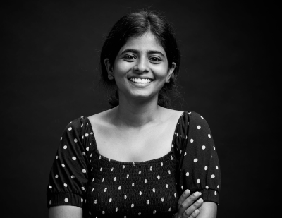 Monochrome portrait of Lavanya against a dark backdrop alongside a graphic name card stating 'Lavanya, The Fashion Aesthete'.