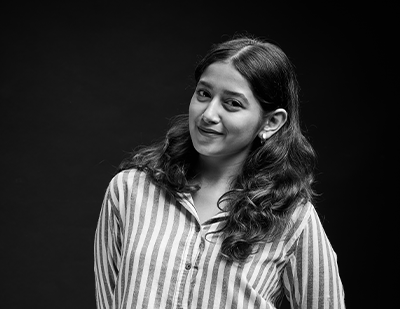 Professional studio portrait of Rutuja smiling at the camera, paired with a graphic name slide identifying her as 'Rutuja – The Creative Pixie'.