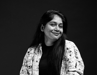 Black-and-white portrait of Supriya, smiling, paired with a bold title card reading 'Supriya – The Strategy Godmother.'